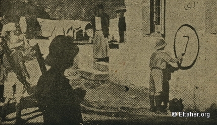 1938 - British troops marking a house